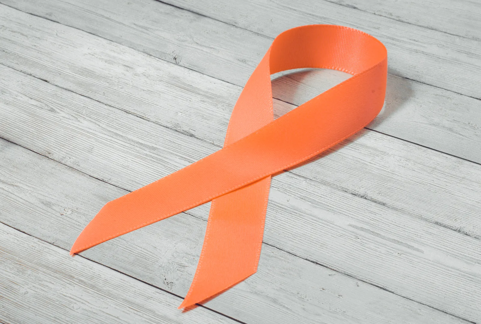 Orange ribbon, the symbol of the campaign against violence against women and girls