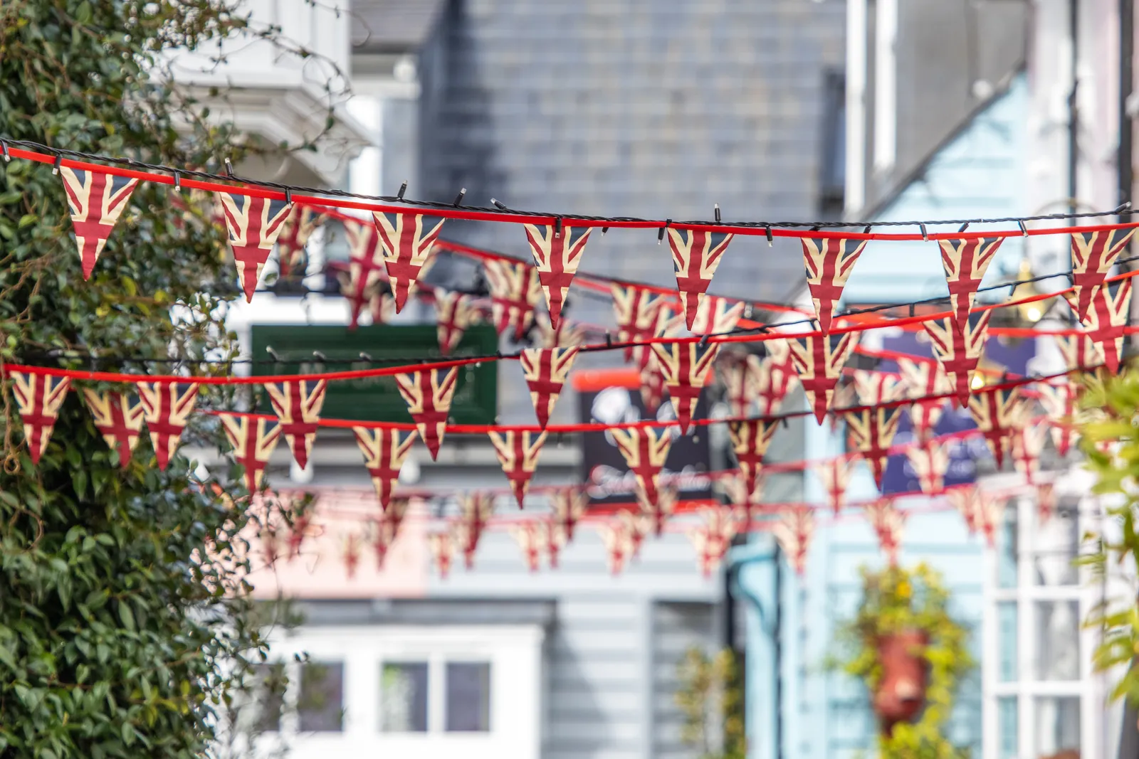 Union Jack bunting strung across a British street for a VE Day celebration