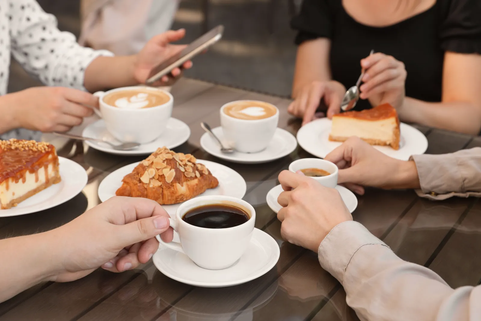 Macmillan Coffee Morning: Friends sharing coffee and cake around a table
