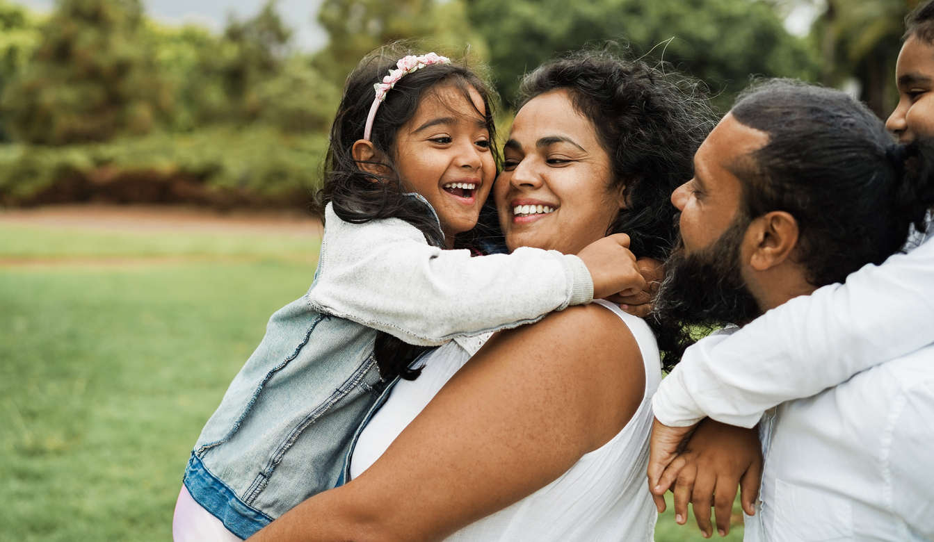 Parent and daughter embracing for National Daughters Day