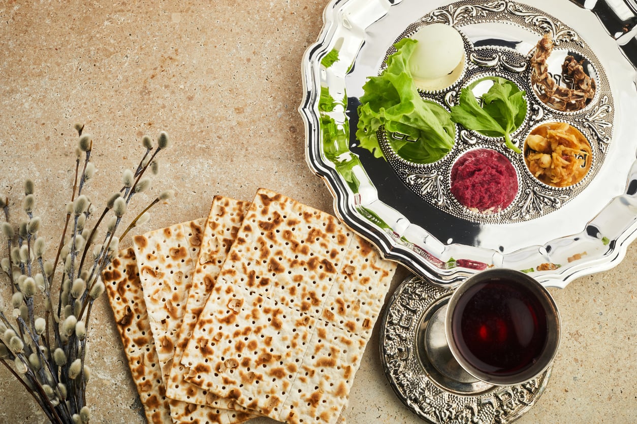 Passover Seder table with matzah and traditional foods for Pesach