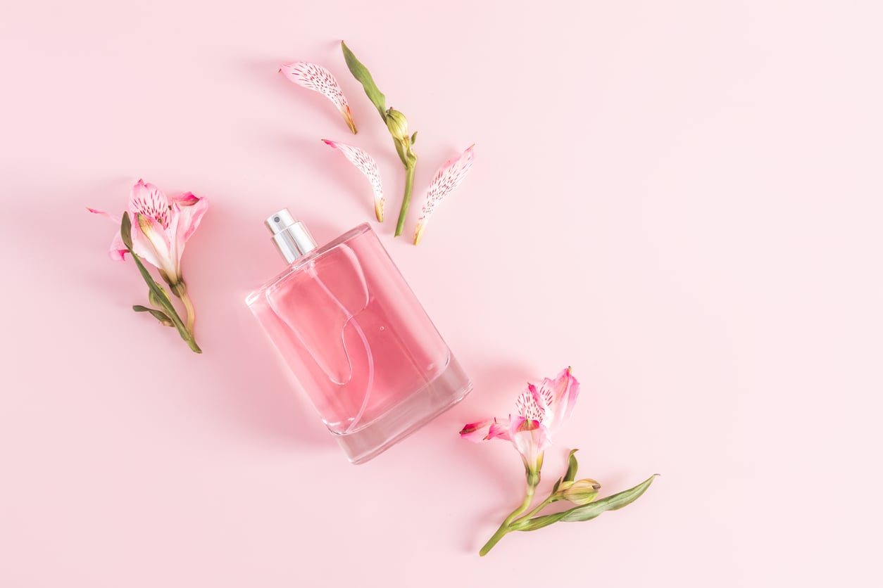 Perfume bottle with flowers for National Fragrance Day