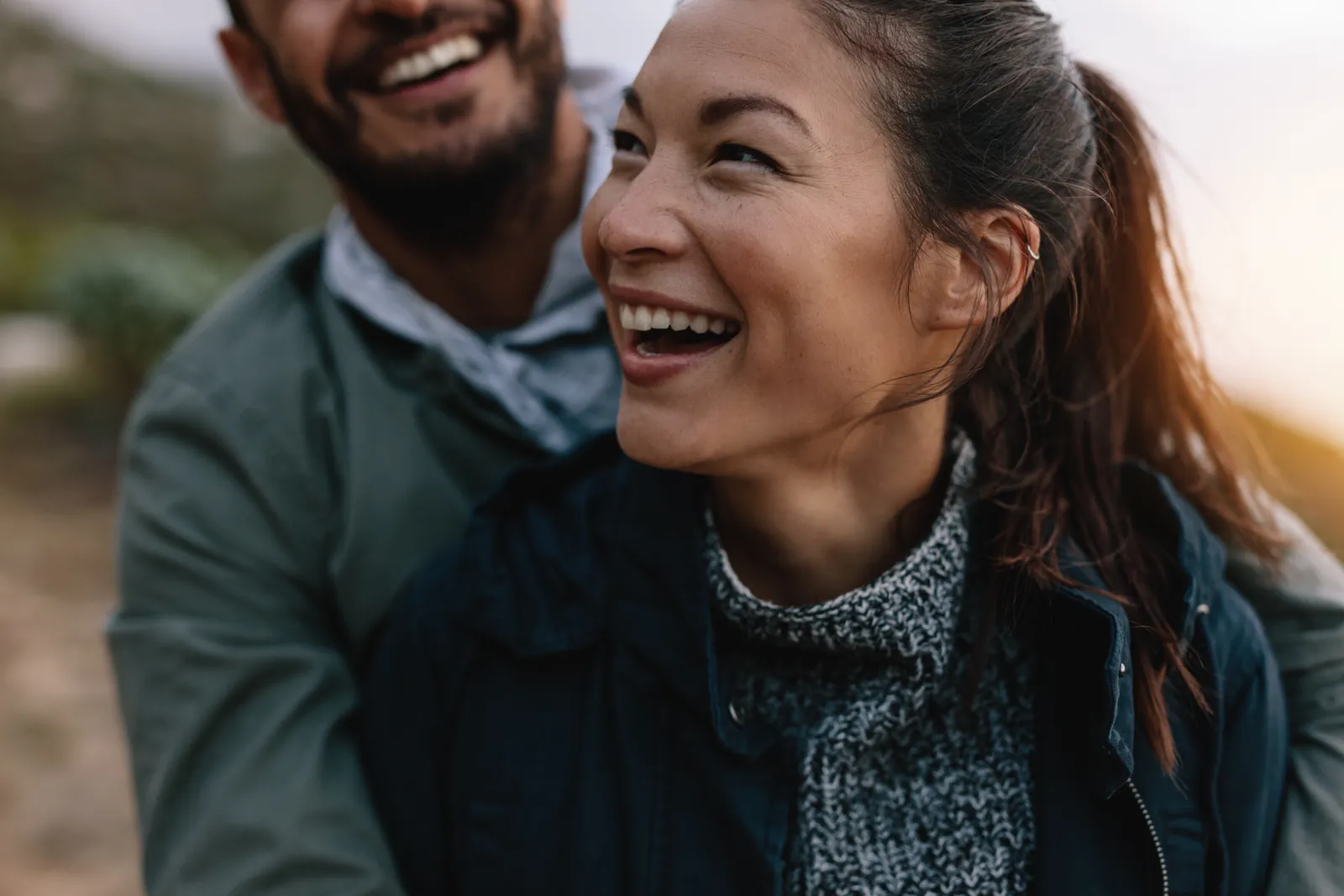National Couples Day: Couple laughing together outdoors