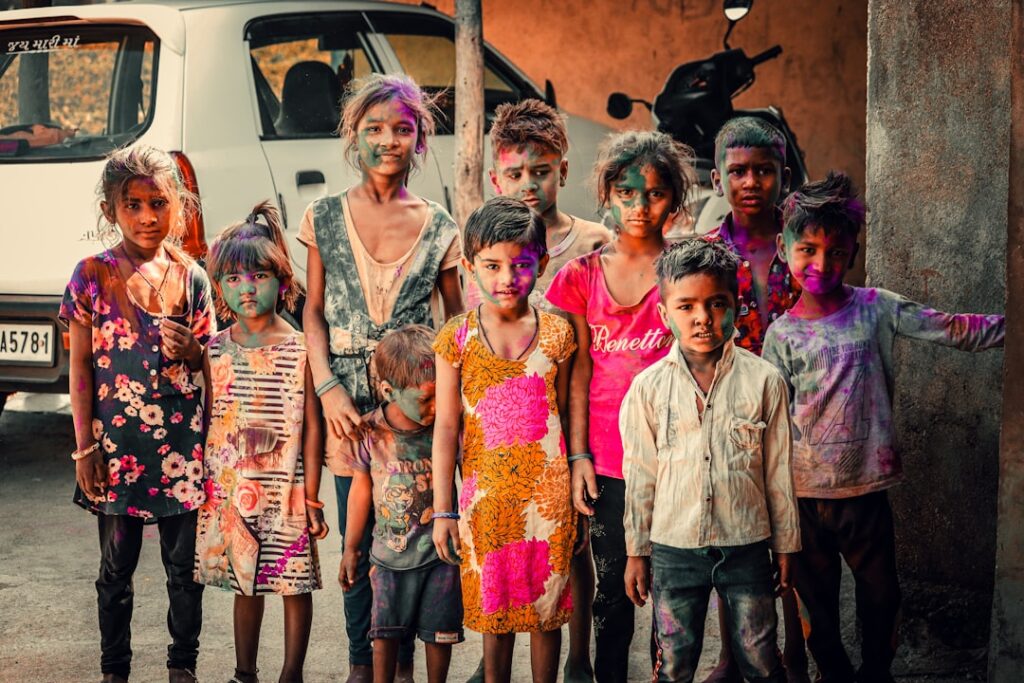 People celebrating Holi festival with coloured powder