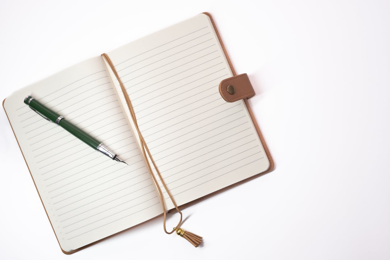 Open notebook with poetry and pen for National Poetry Month