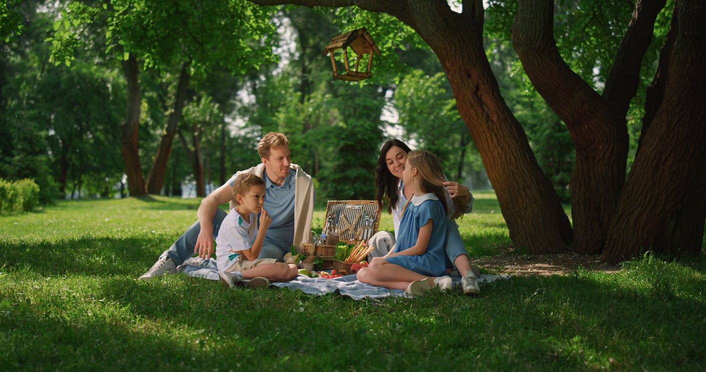 Family picnic outdoors for International Picnic Day