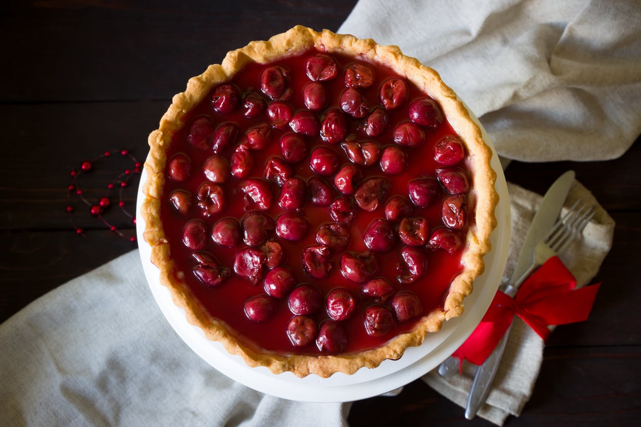 Cherry tart pastry topped with red cherries