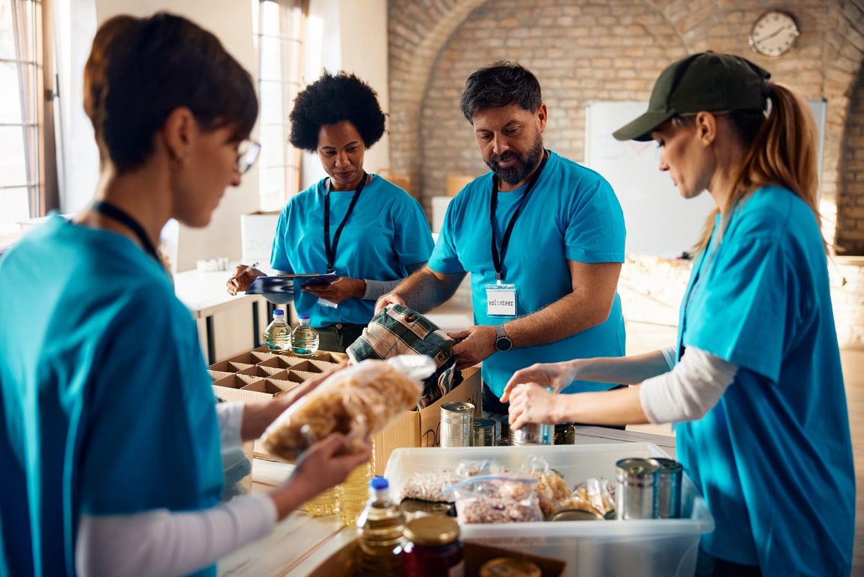 Volunteers sorting food donations at a food bank for National Food Bank Day