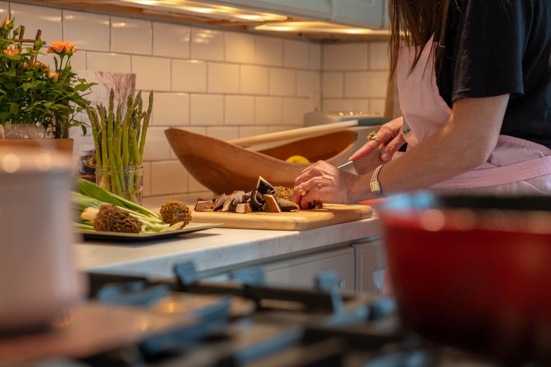 A chaotic home kitchen scene, celebrating National Kitchen Klutzes of America Day