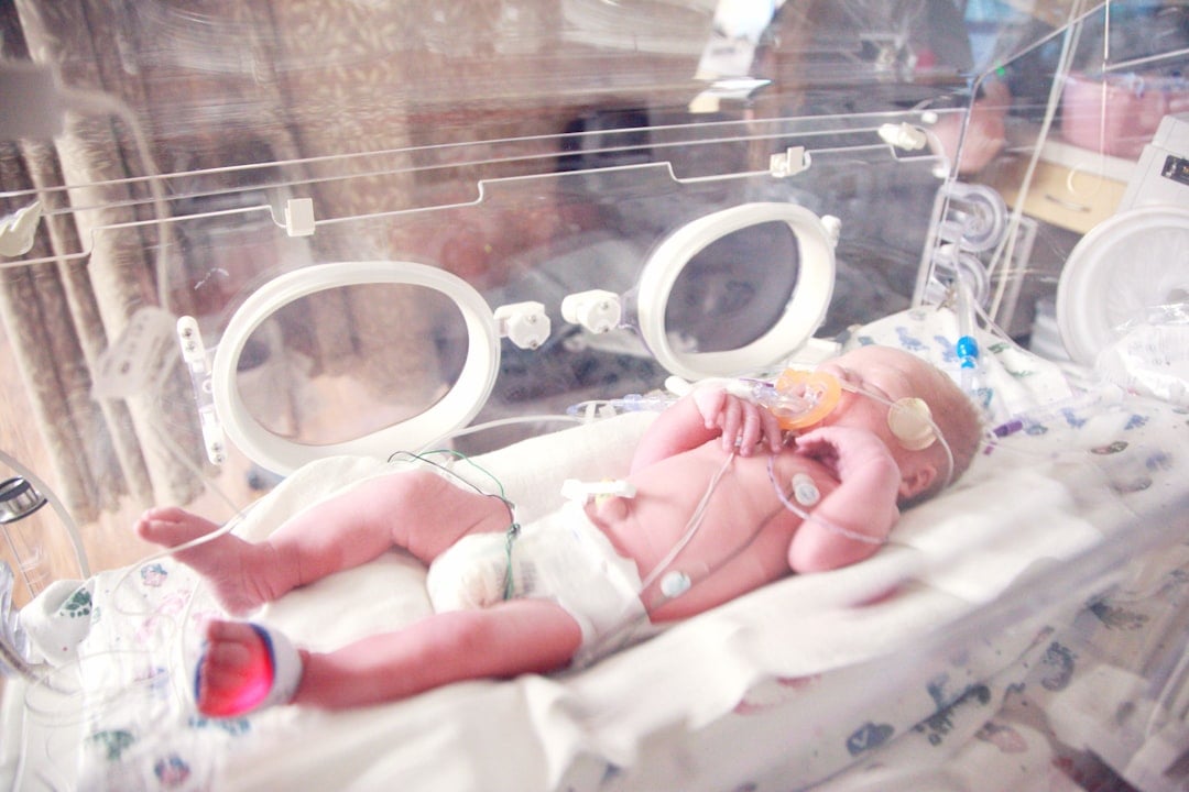 A premature newborn baby receiving care in a neonatal intensive care unit during NICU Awareness Month