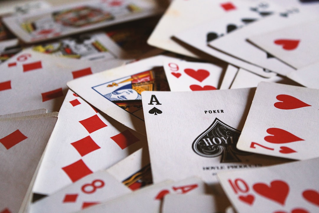 Vintage playing cards spread on a table for According to Hoyle Day