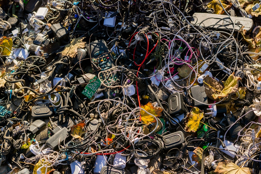 Pile of discarded electronic devices and circuit boards for recycling on International E-Waste Day