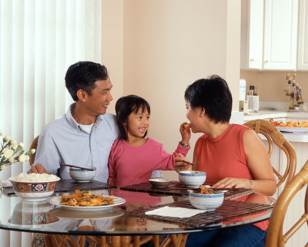 A family sharing a meal together at the dinner table