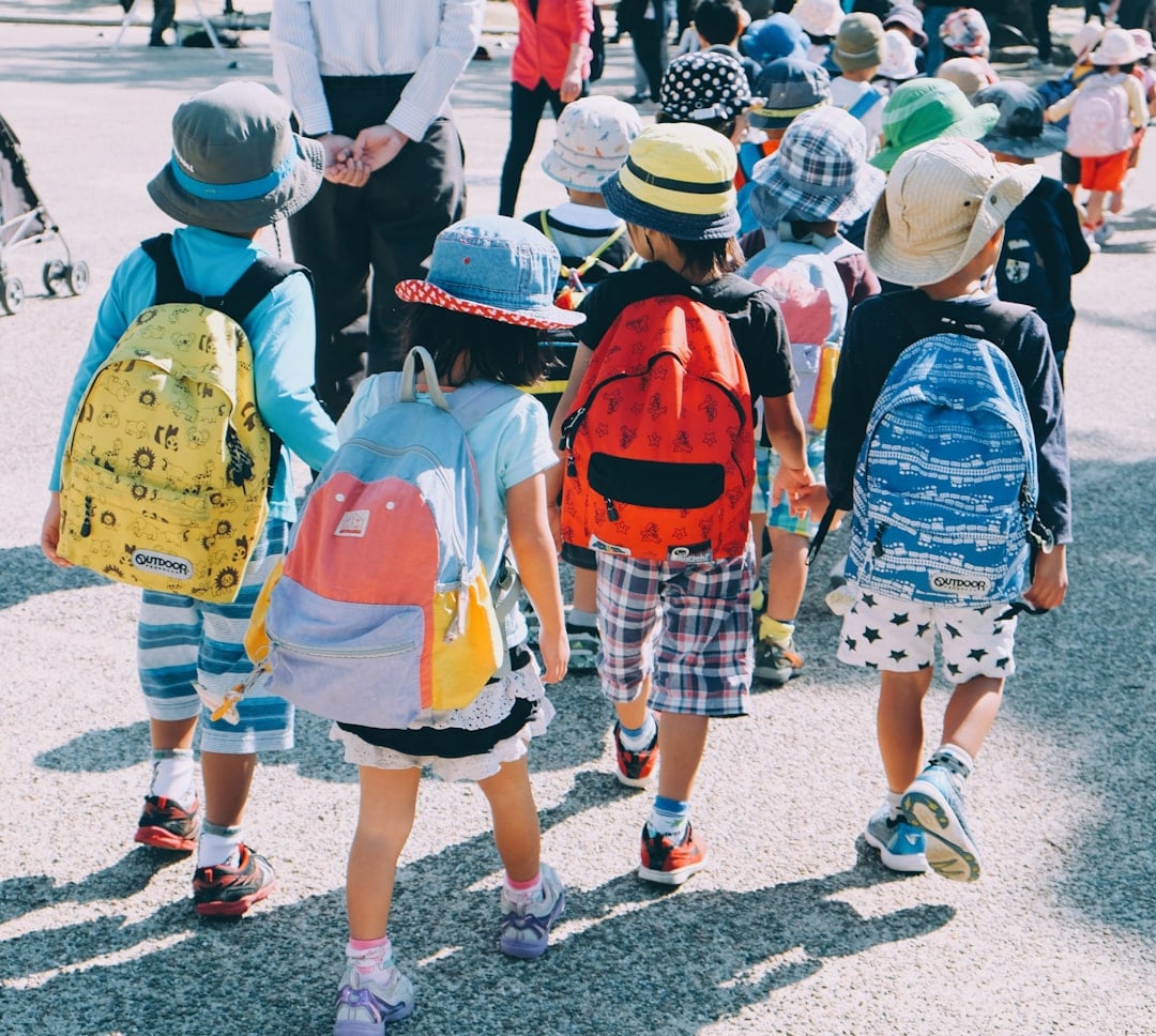 Child wearing a school backpack