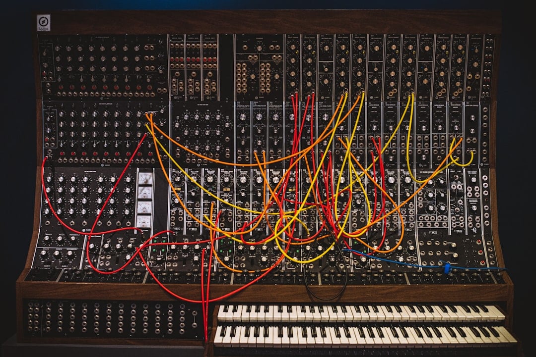 Experimental musician playing an unusual synthesizer setup