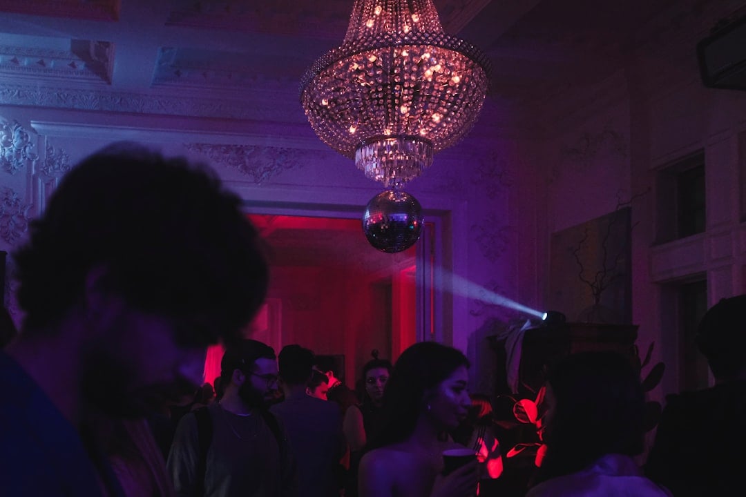 People dancing energetically at a colourful funk music party