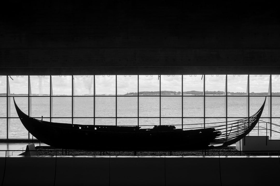 A Viking longship sailing across the open sea, evoking Leif Erikson's Norse voyages