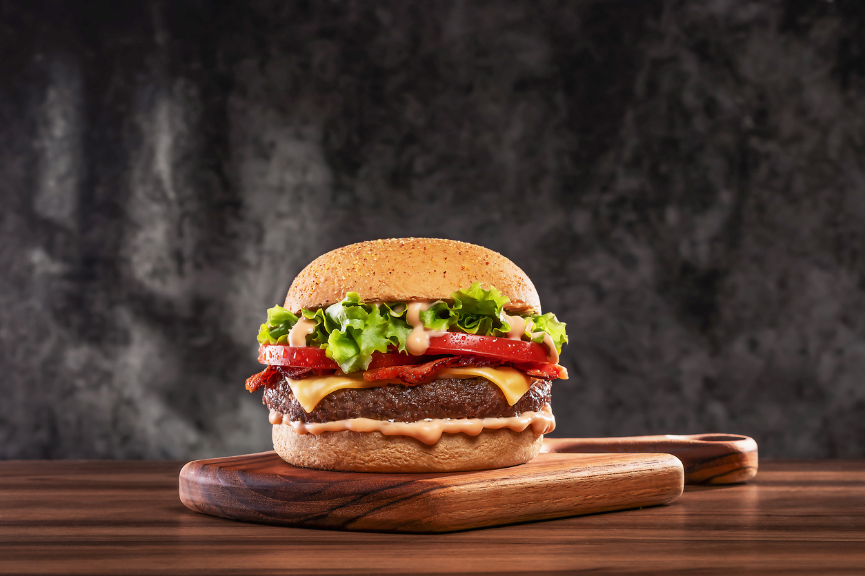 A gourmet hamburger with fresh toppings