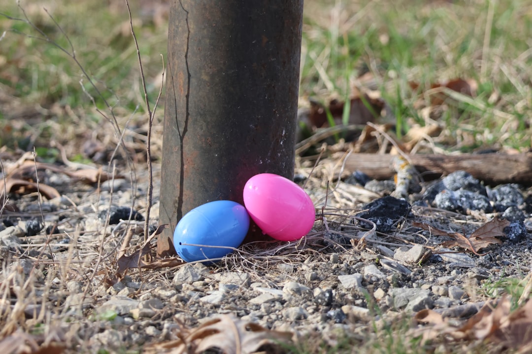 Two people playing an egg toss game outdoors