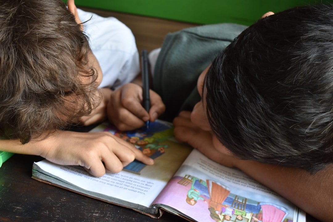 Children reading books in a community setting
